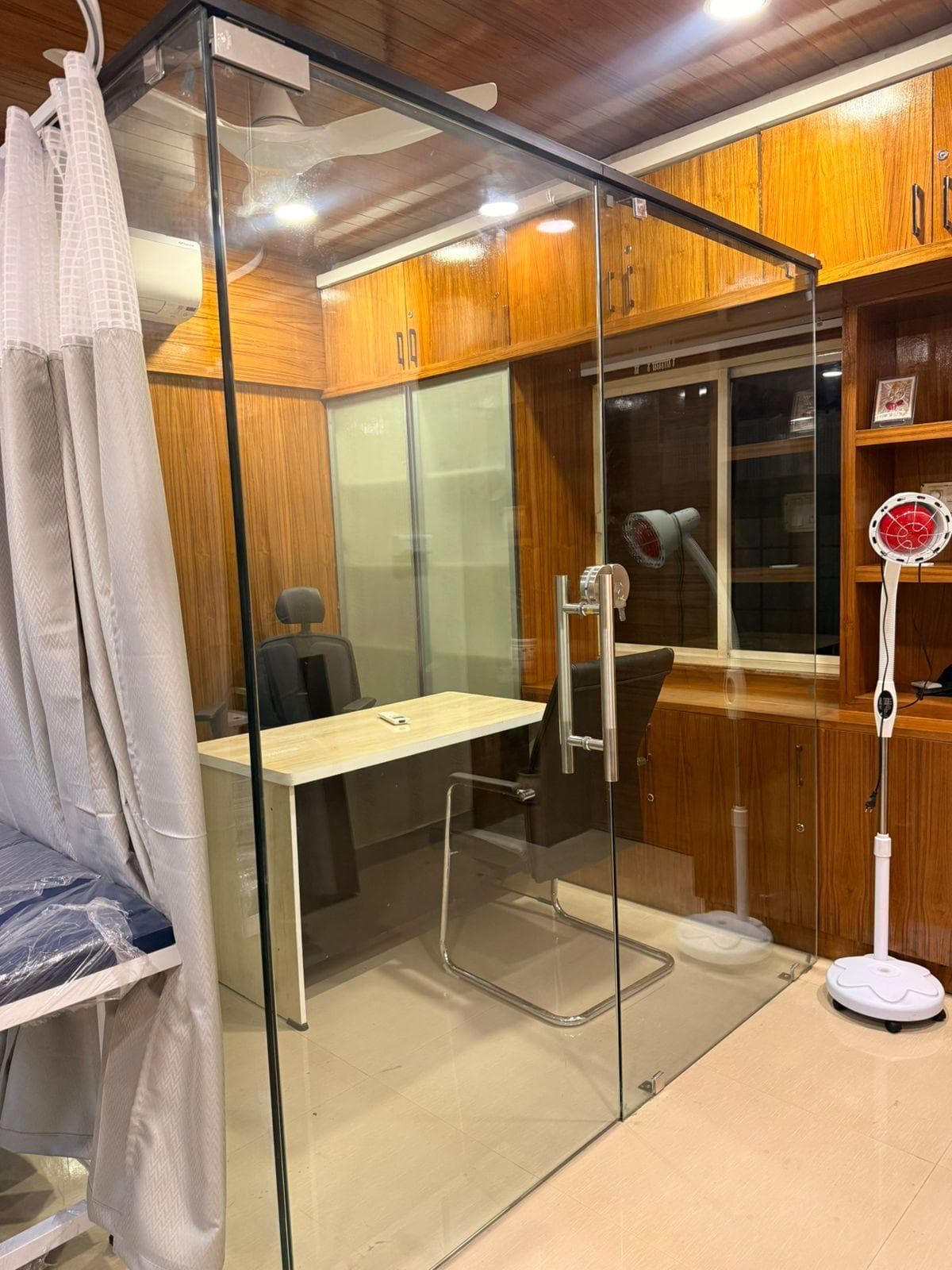 Private consultation room with treatment table at VedaKinetics